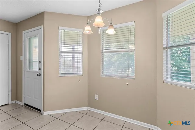 a view of an empty room with window