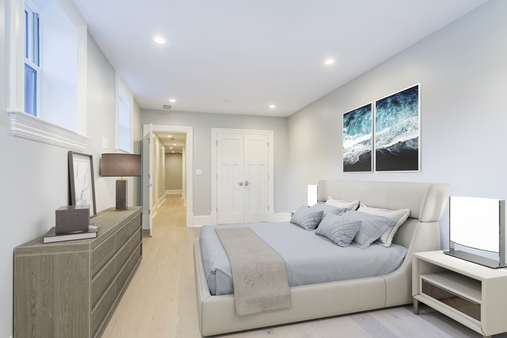 47 Chestnut Street, Unit 1 Boston, MA 02129 - Photo 14 of 17 a bedroom with furniture and a lamp