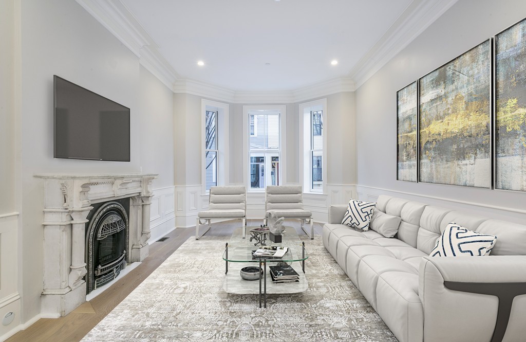47 Chestnut Street, Unit 1 Boston, MA 02129 - Photo 3 of 17 a living room with furniture and a fireplace