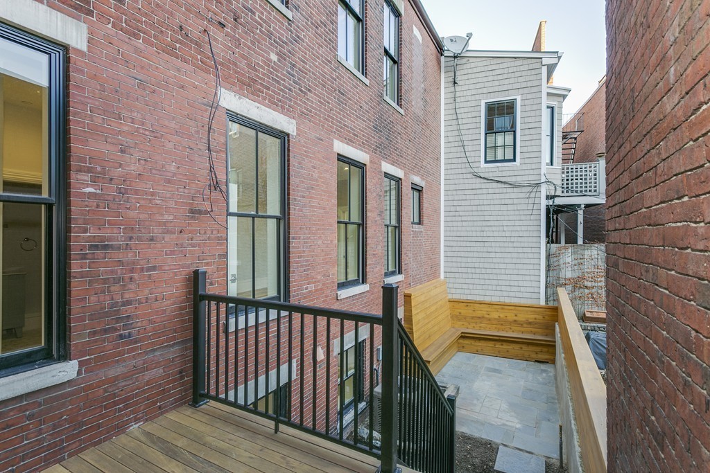47 Chestnut Street, Unit 1 Boston, MA 02129 - Photo 5 of 17 a view of a brick house with wooden floor and a window