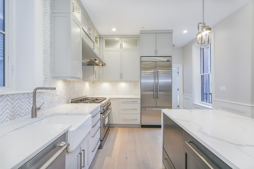 47 Chestnut Street, Unit 1 Boston, MA 02129 - Photo 10 of 17 a kitchen with a sink stainless steel appliances and cabinets