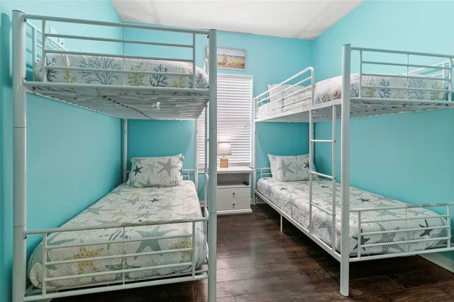 a bedroom with bed and window