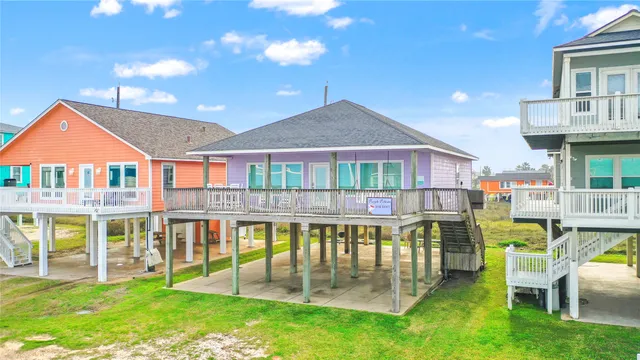 a front view of a house with a yard table and chairs
