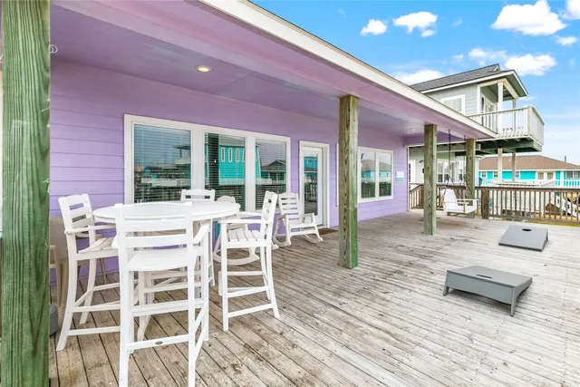 a view of a dinning table and chairs in the patio