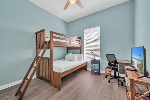 a bedroom with furniture and a window