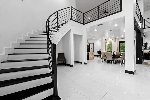 a view of entryway and hall with dining room