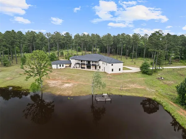a view of a lake with a big yard