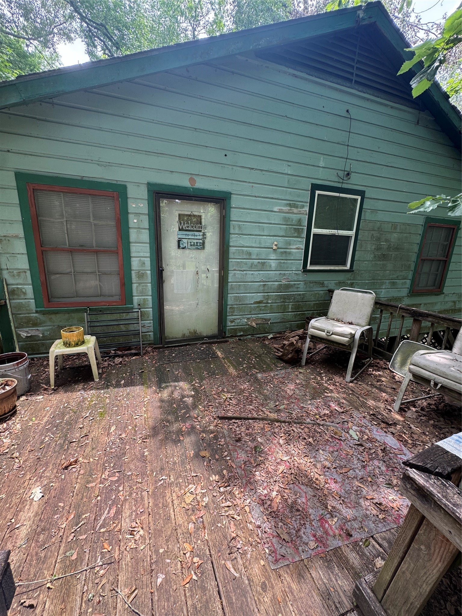45 County Road 2859 Cleveland, TX 77327 - Photo 5 of 15 a backyard of a house with chairs and wooden fence