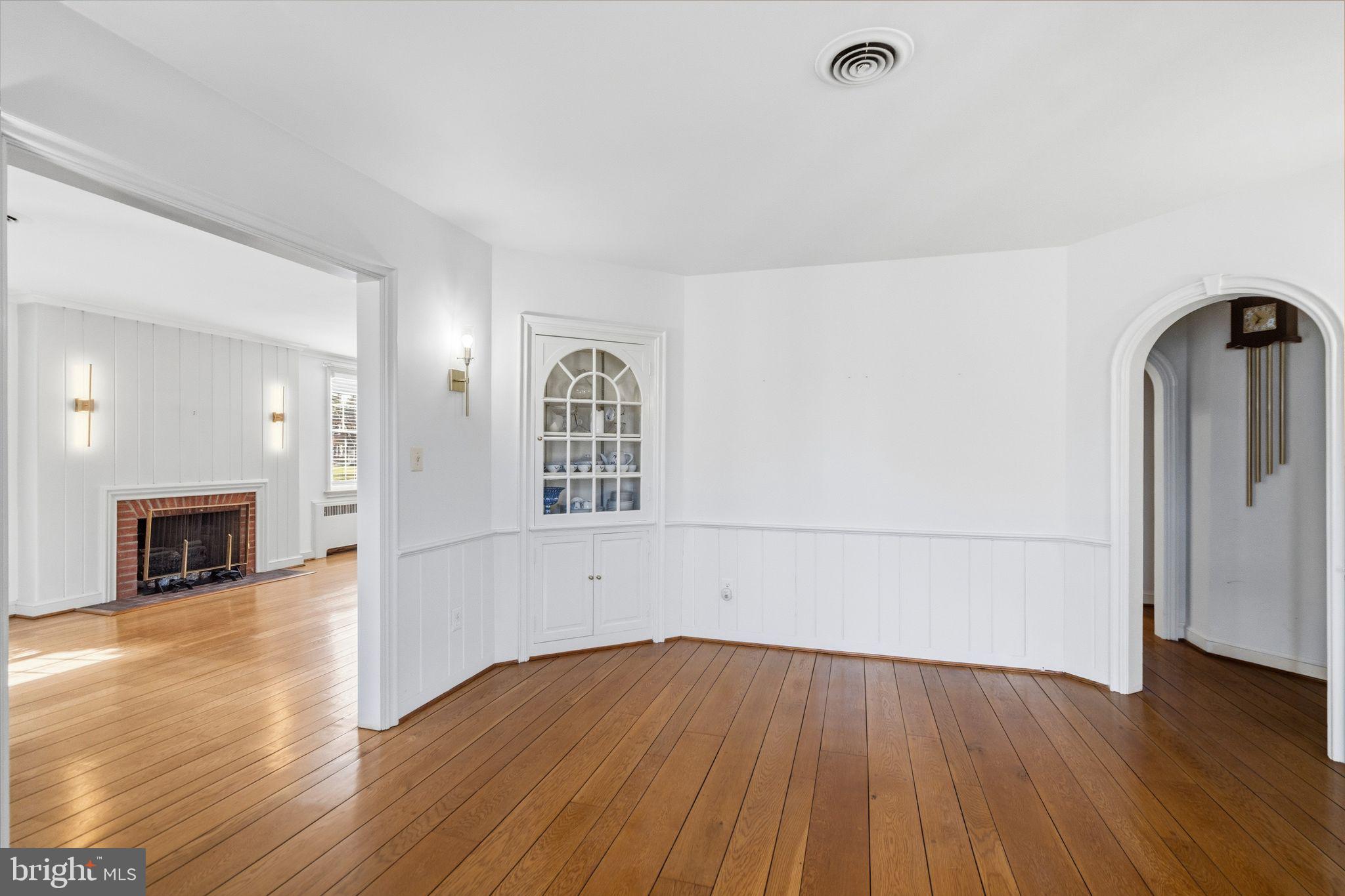 2116 Branch Avenue Southeast Washington, DC 20020 - Photo 11 of 32 wooden floor in an empty room with a window