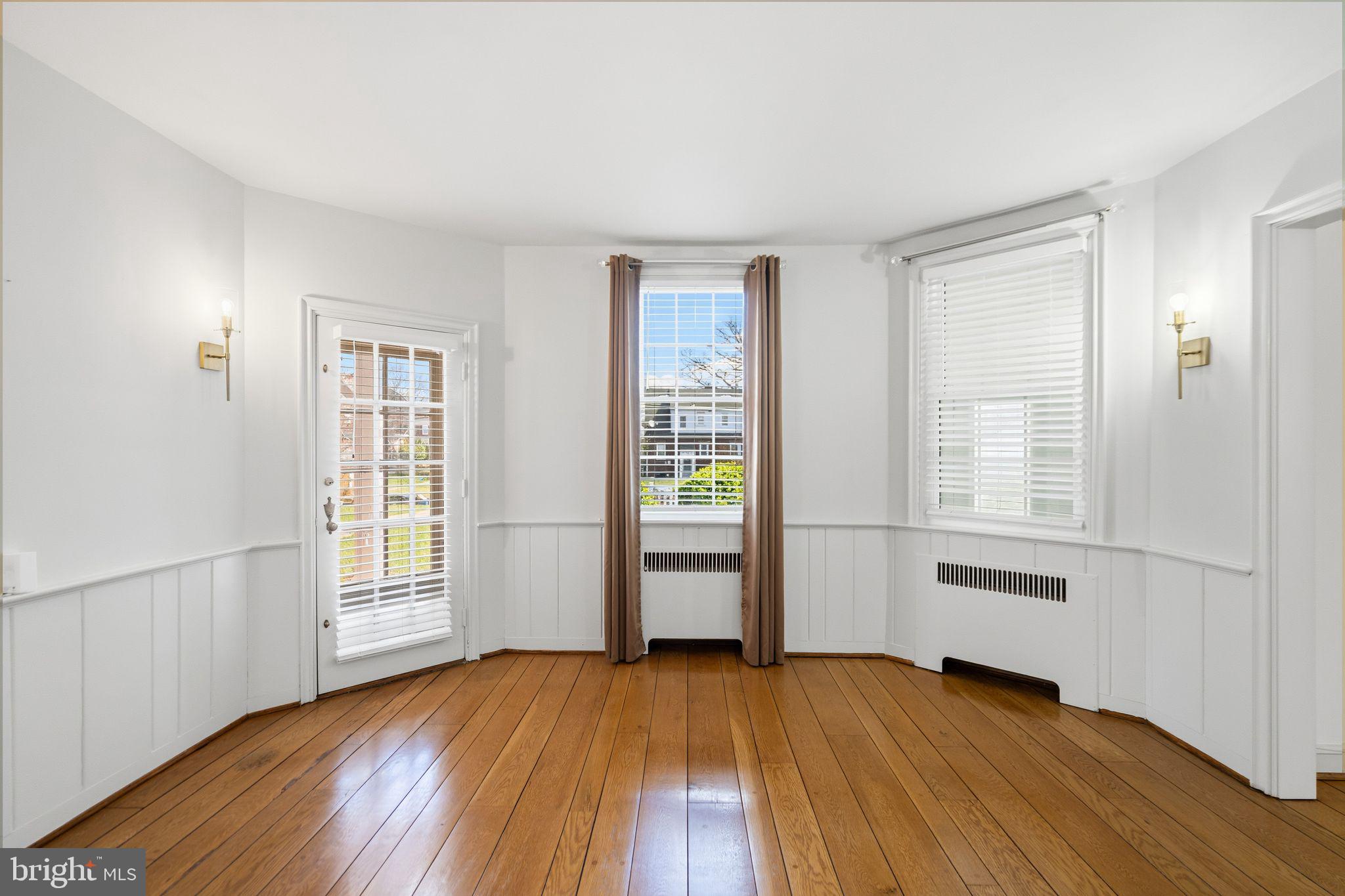 2116 Branch Avenue Southeast Washington, DC 20020 - Photo 12 of 32 an empty room with wooden floor and windows