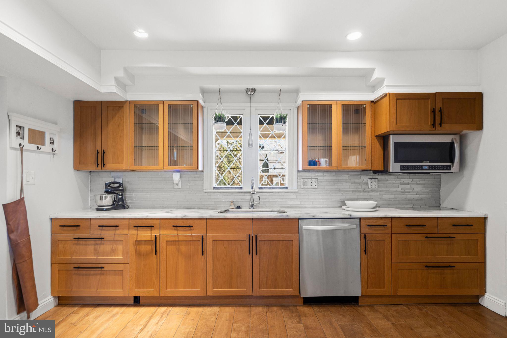 2116 Branch Avenue Southeast Washington, DC 20020 - Photo 14 of 32 a kitchen with a sink cabinets and window