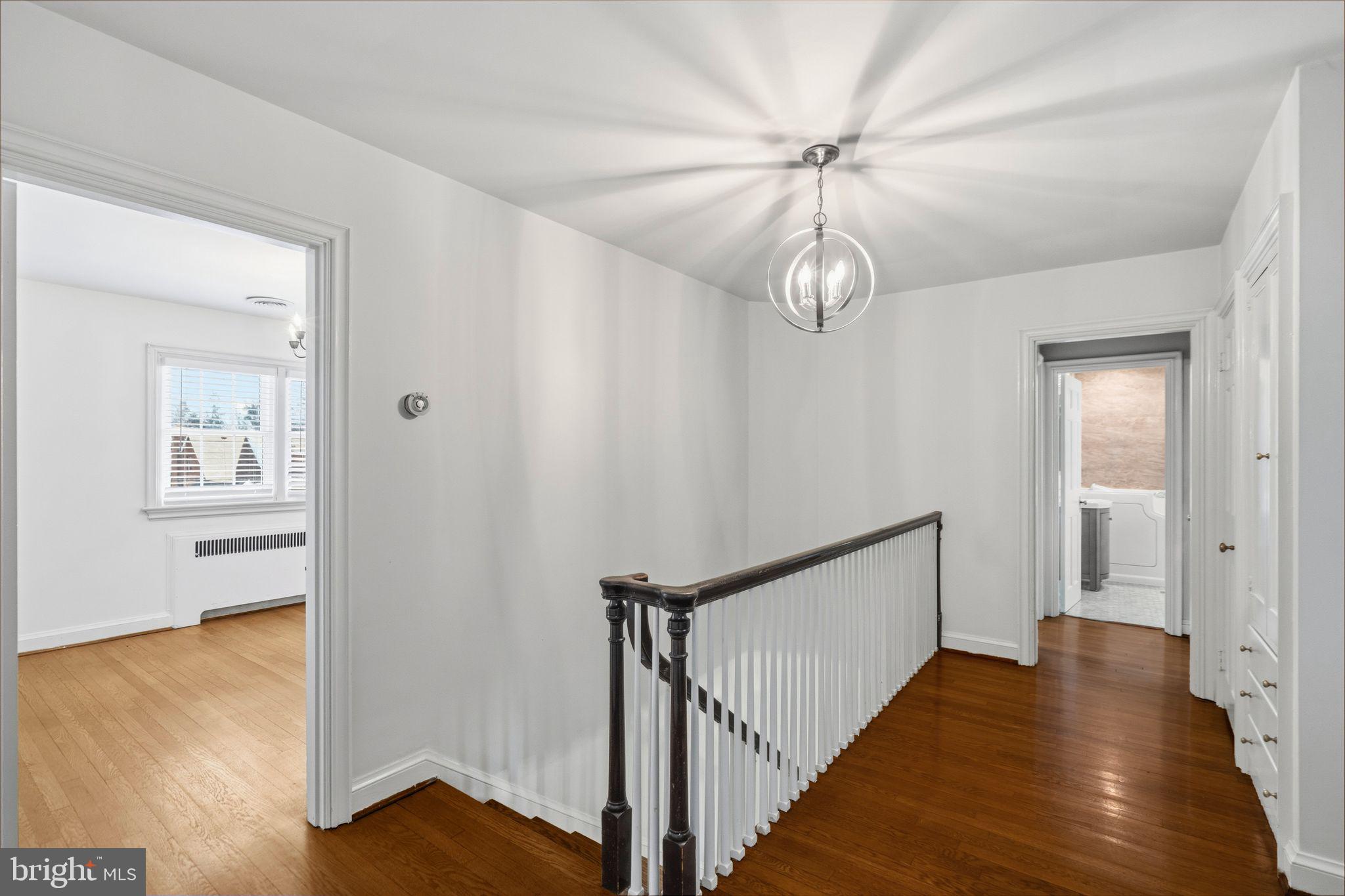 2116 Branch Avenue Southeast Washington, DC 20020 - Photo 18 of 32 a view of a hallway with wooden floor and staircase