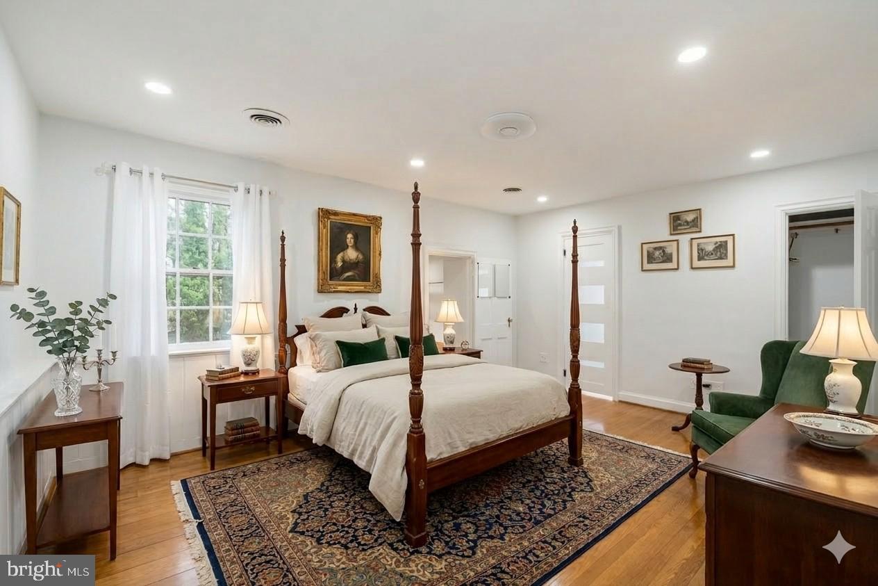 2116 Branch Avenue Southeast Washington, DC 20020 - Photo 19 of 32 a bedroom with a bed and wooden floor