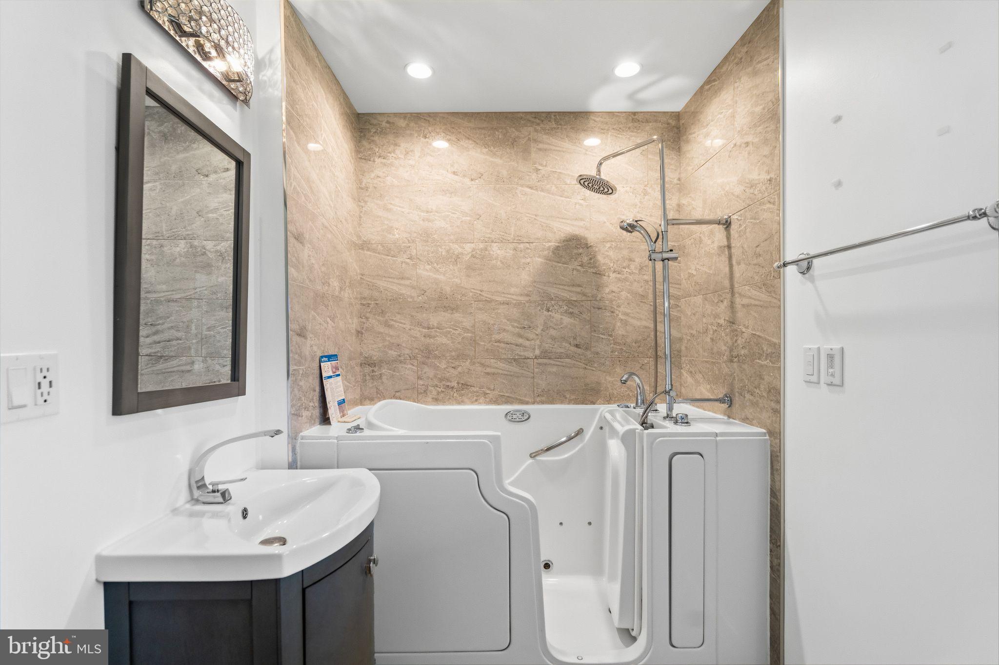 2116 Branch Avenue Southeast Washington, DC 20020 - Photo 22 of 32 a bathroom with a sink and mirror with toilet