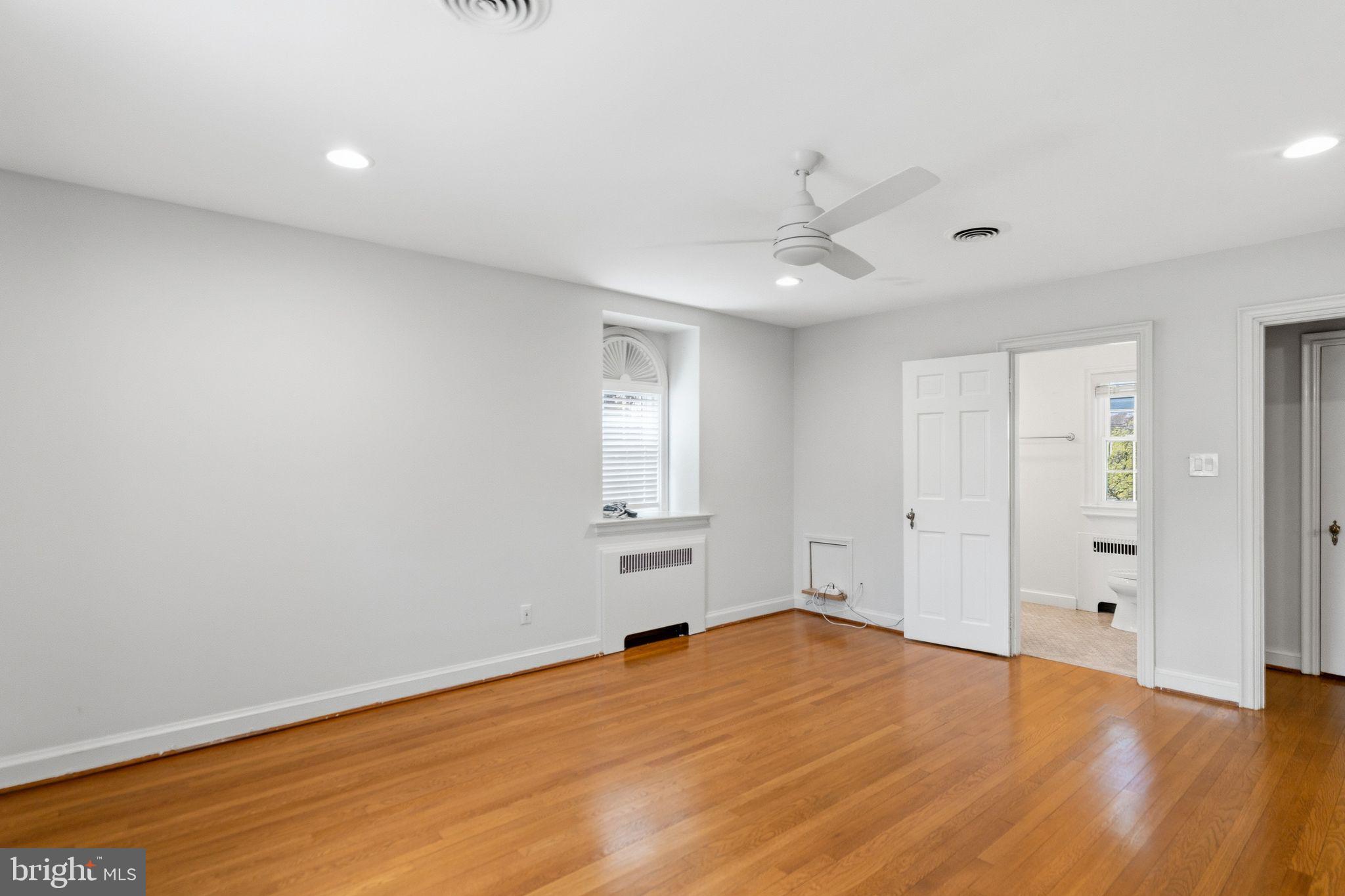 2116 Branch Avenue Southeast Washington, DC 20020 - Photo 23 of 32 wooden floor in an empty room with a window