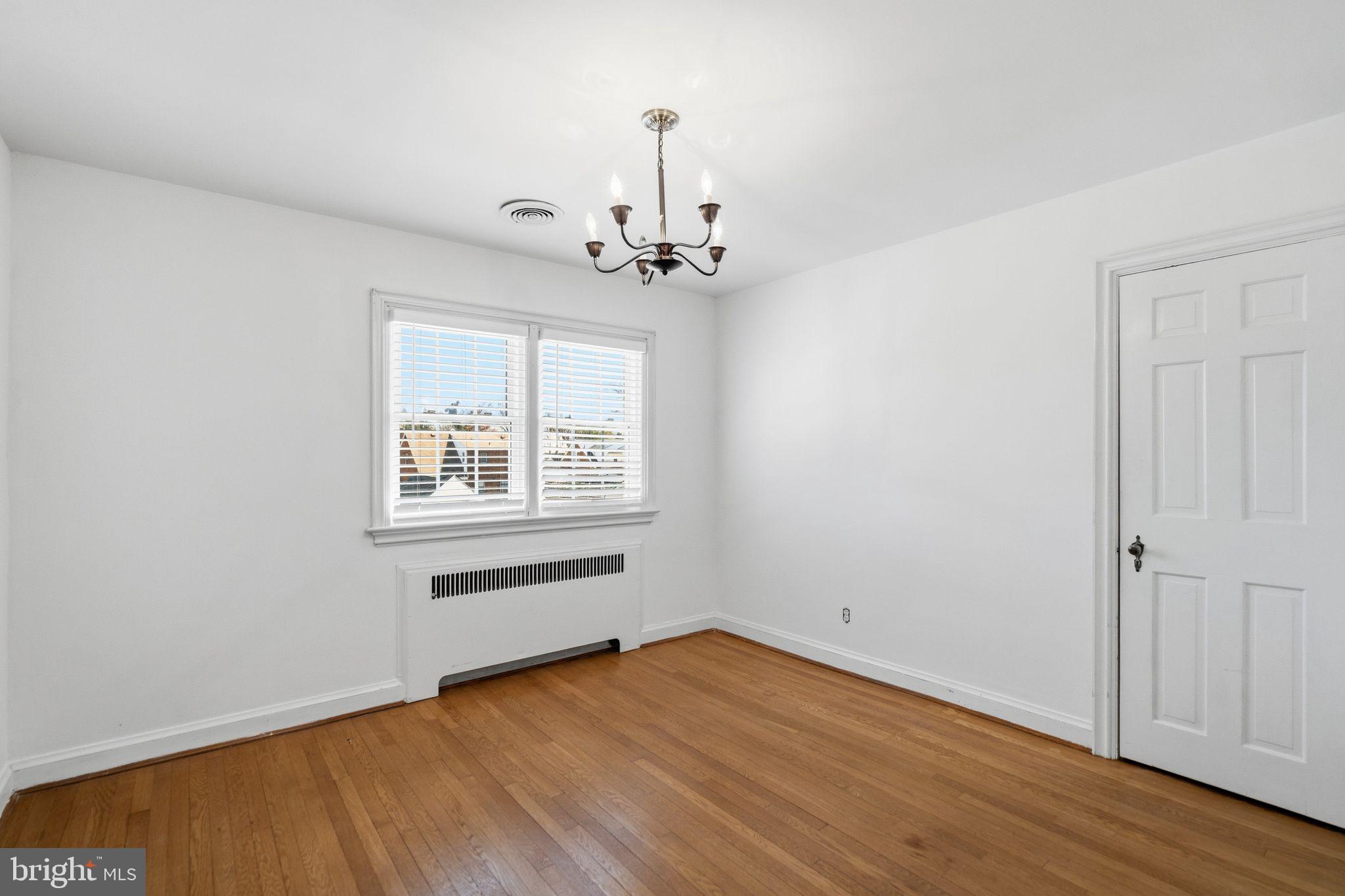 2116 Branch Avenue Southeast Washington, DC 20020 - Photo 25 of 32 wooden floor in an empty room with a window