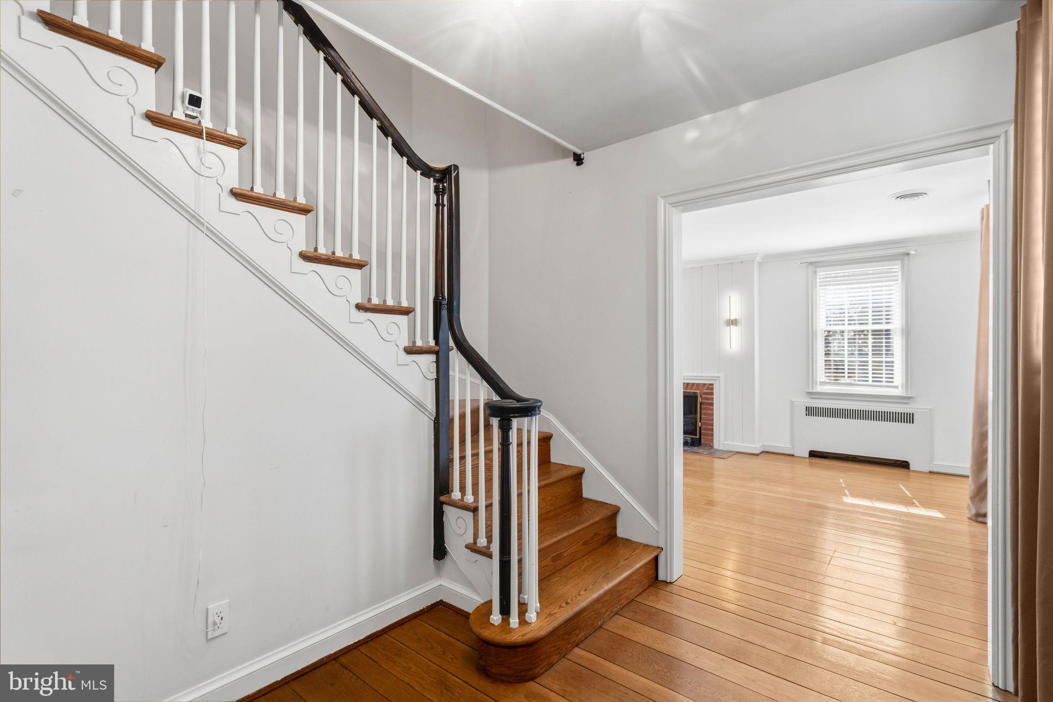 2116 Branch Avenue Southeast Washington, DC 20020 - Photo 3 of 32 a view of front door with wooden floor and stairs