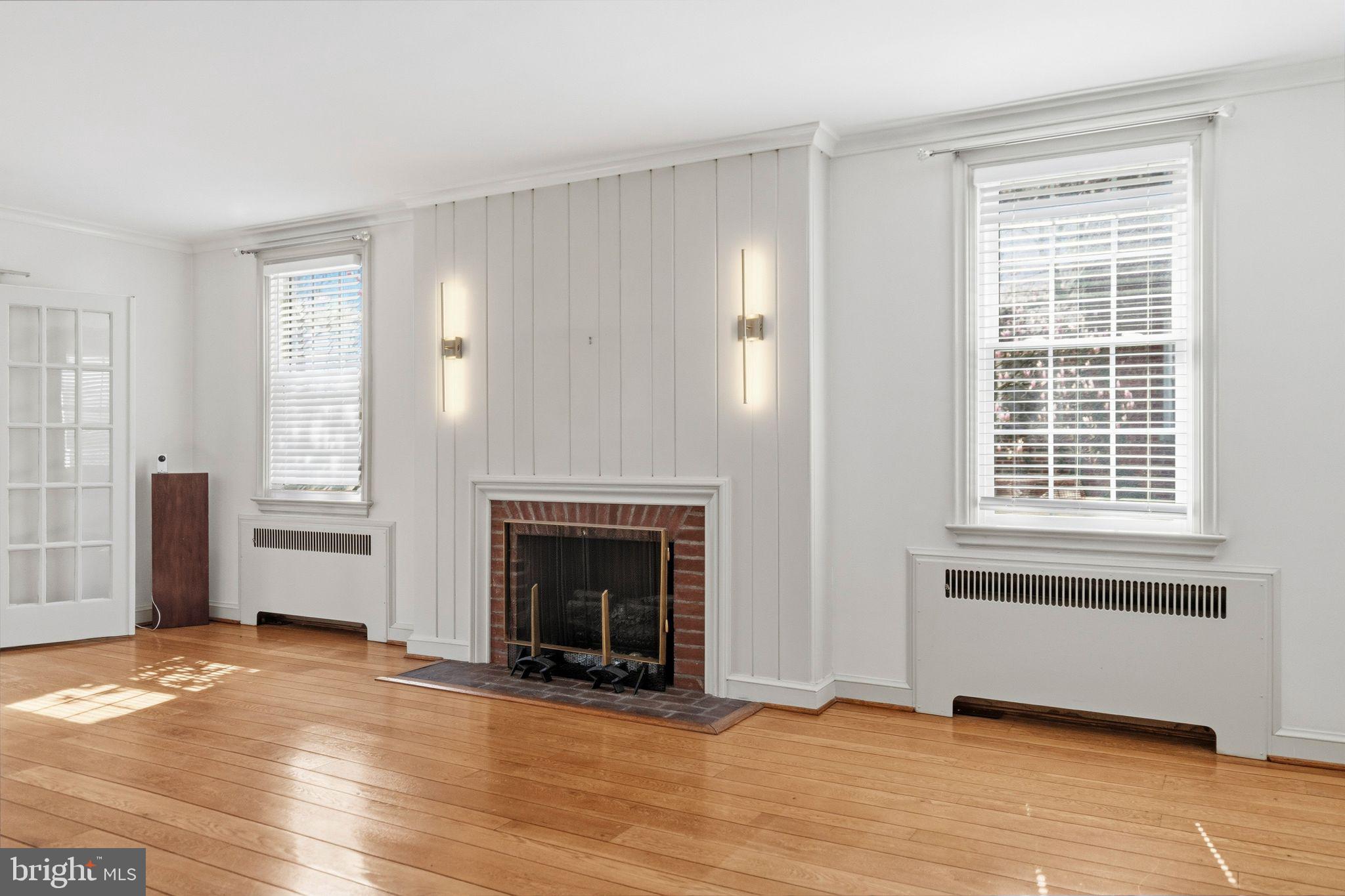 2116 Branch Avenue Southeast Washington, DC 20020 - Photo 5 of 32 an empty room with windows and fireplace