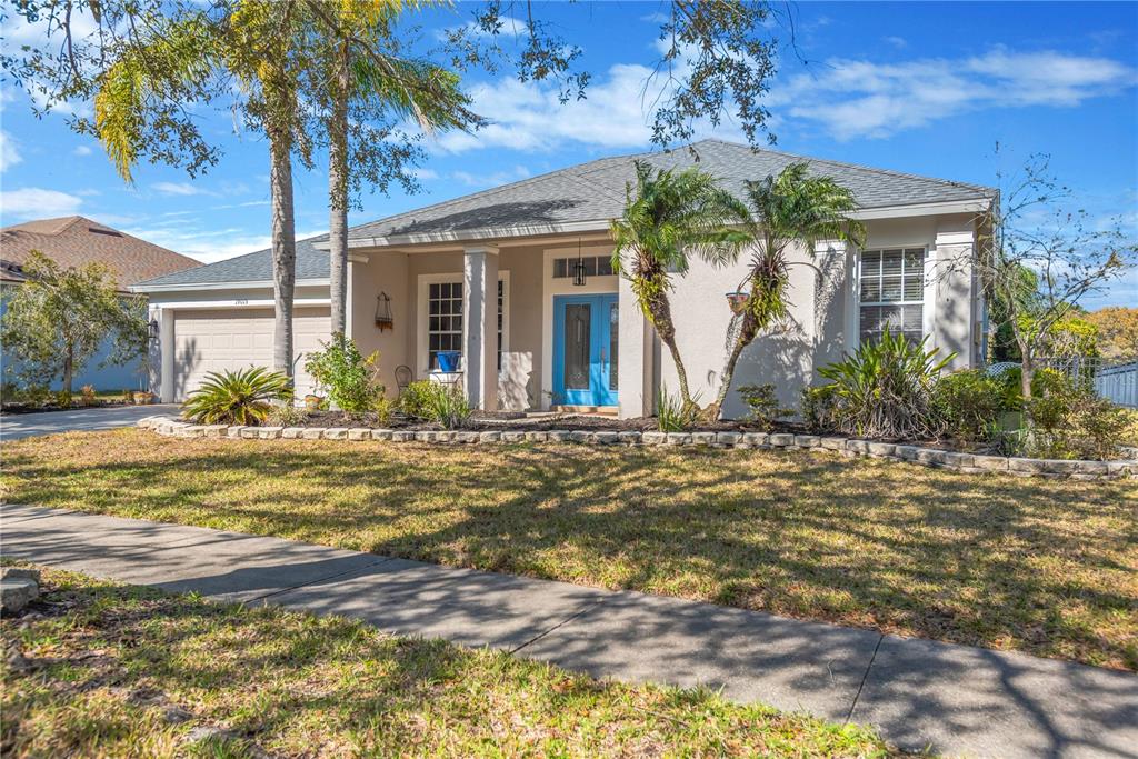19015 Fern Meadow Loop Lutz, FL 33558 - Photo 10 of 50 a front view of a house with garden