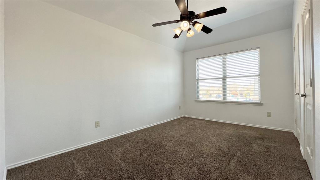 101 Rocky Pine Road McKinney, TX 75072 - Photo 20 of 31 an empty room with windows and fan