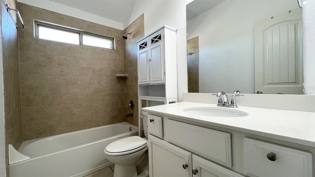 101 Rocky Pine Road McKinney, TX 75072 - Photo 23 of 31 a bathroom with a sink a toilet and shower