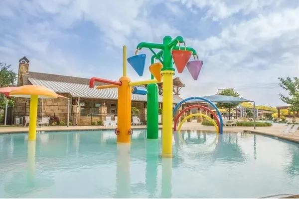 a view of a swimming pool with a patio