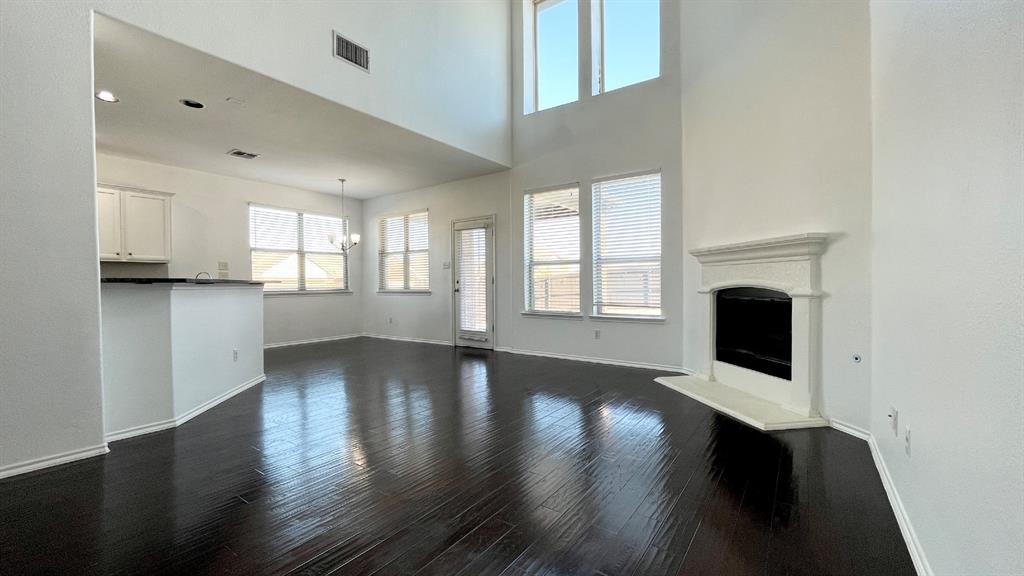 101 Rocky Pine Road McKinney, TX 75072 - Photo 6 of 31 a view of a kitchen with wooden floor and a window
