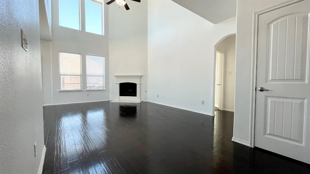101 Rocky Pine Road McKinney, TX 75072 - Photo 7 of 31 an empty room with wooden floor and windows