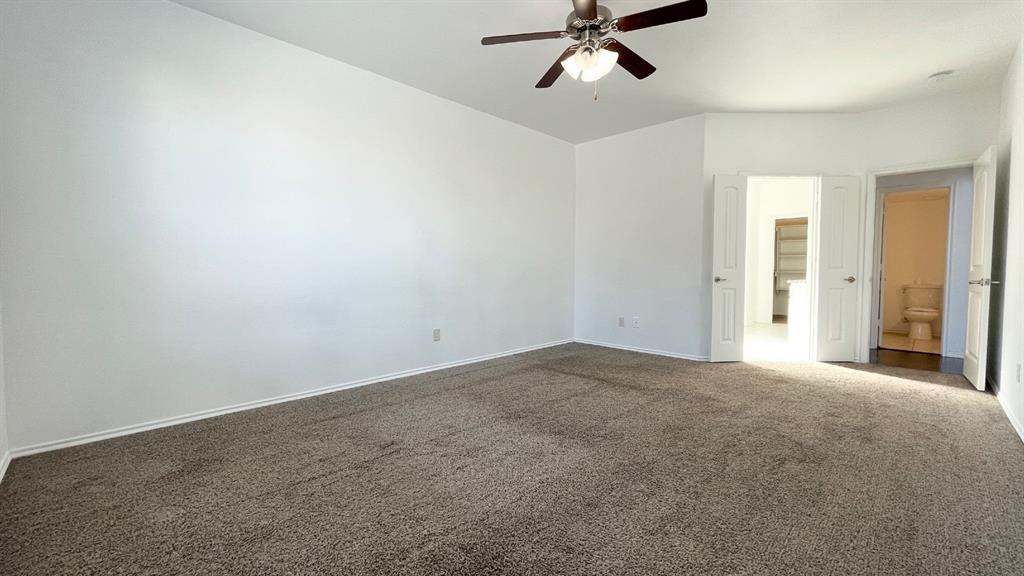 101 Rocky Pine Road McKinney, TX 75072 - Photo 10 of 31 a view of a big room with windows and chandelier fan