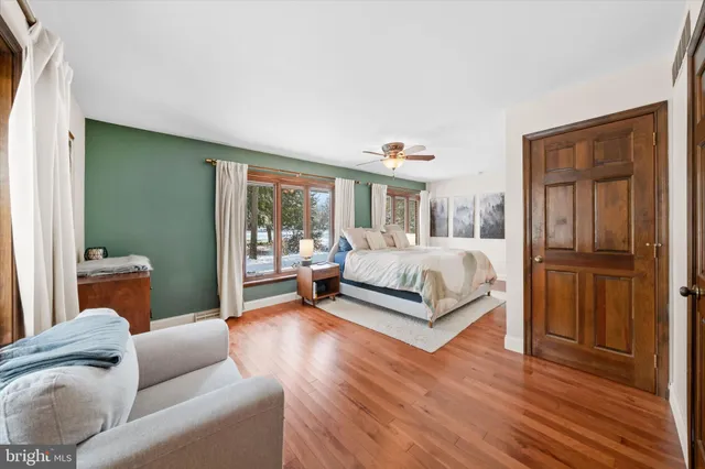 a bedroom with a bed and a couch