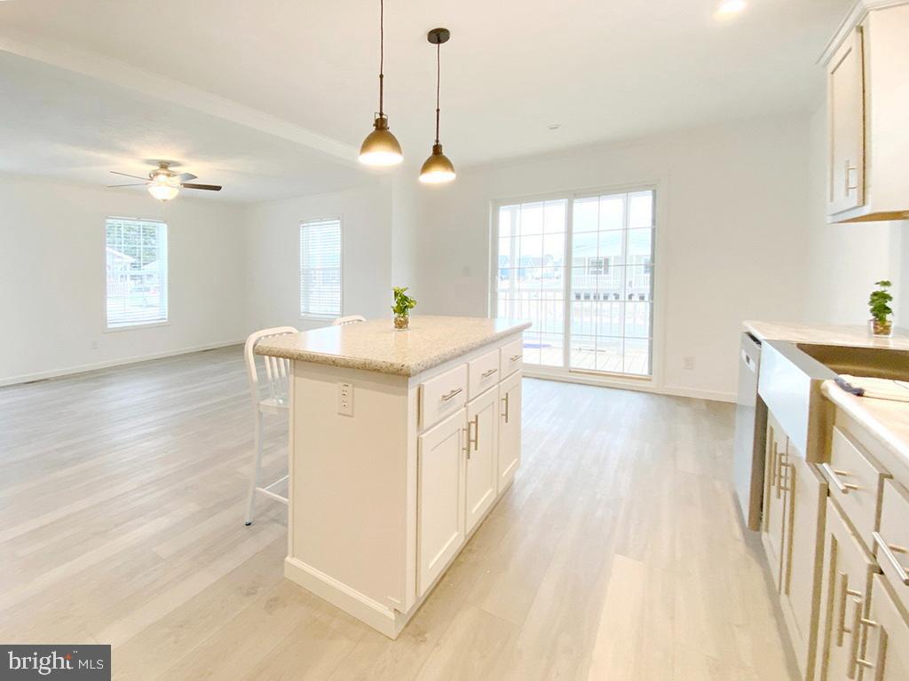 11 Folkstone Lane Lewes, DE 19958 - Photo 20 of 47 a view of a kitchen with wooden floor and windows