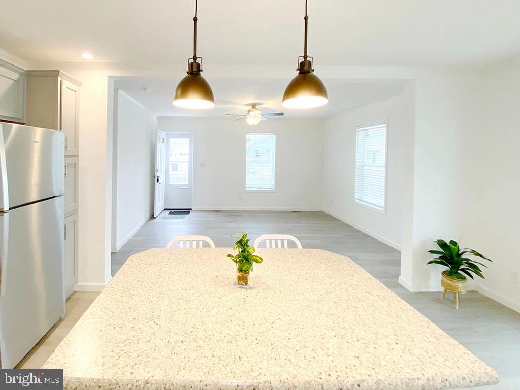 11 Folkstone Lane Lewes, DE 19958 - Photo 21 of 47 a white room with window and a chandelier