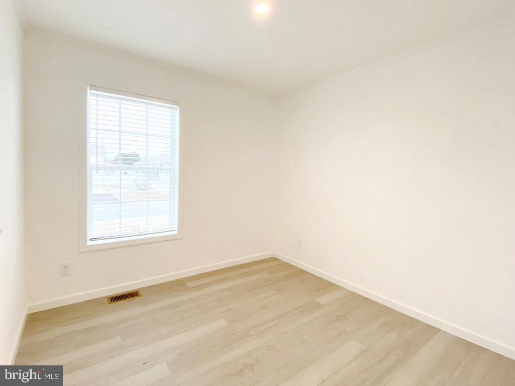 11 Folkstone Lane Lewes, DE 19958 - Photo 22 of 47 an empty room with a window