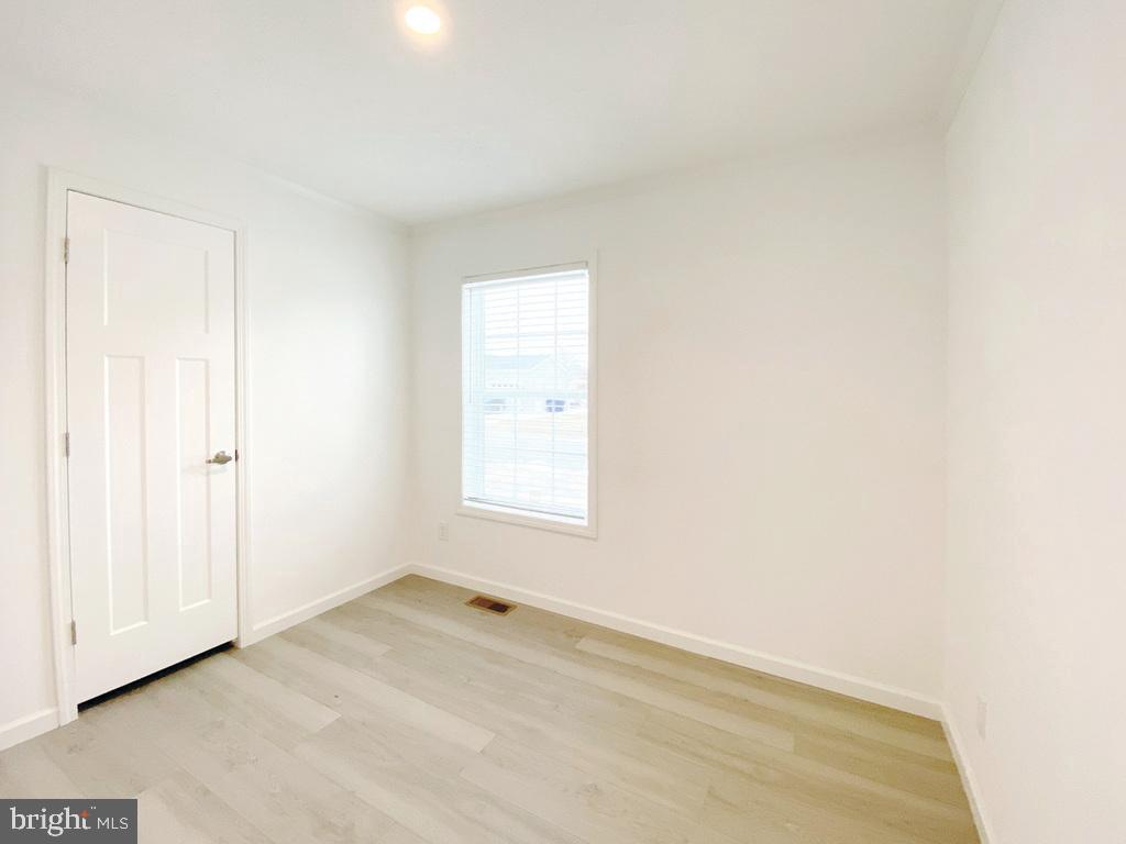 11 Folkstone Lane Lewes, DE 19958 - Photo 23 of 47 an empty room with a window