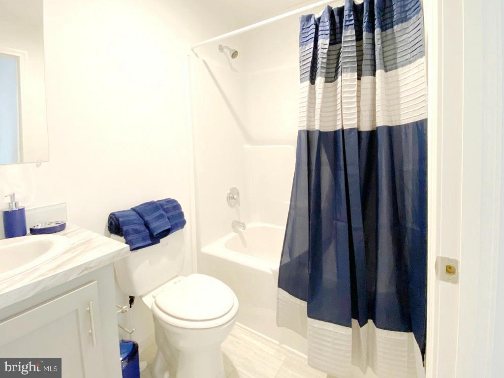 11 Folkstone Lane Lewes, DE 19958 - Photo 25 of 47 a white toilet sitting next to a bathroom sink