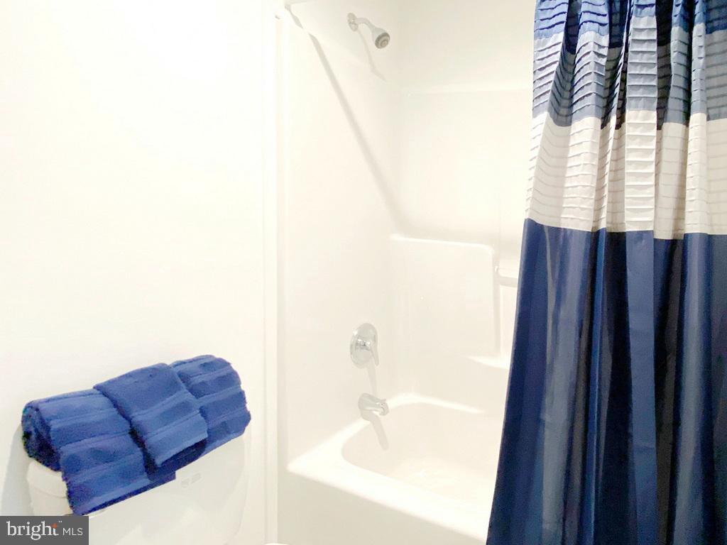 11 Folkstone Lane Lewes, DE 19958 - Photo 26 of 47 a bathroom with a sink and a mirror