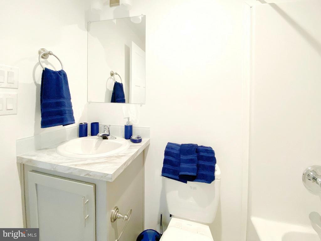 11 Folkstone Lane Lewes, DE 19958 - Photo 27 of 47 a bathroom with a toilet sink and mirror