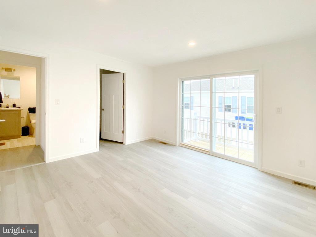 11 Folkstone Lane Lewes, DE 19958 - Photo 29 of 47 an empty room with windows and entrance