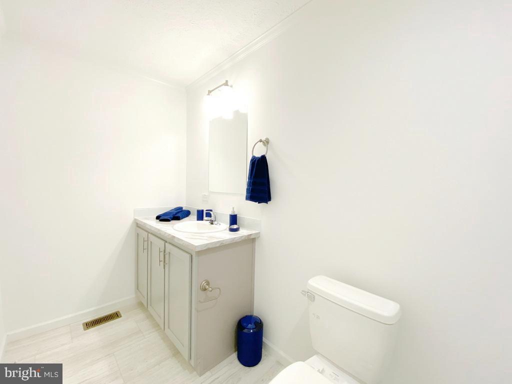 11 Folkstone Lane Lewes, DE 19958 - Photo 33 of 47 a bathroom with a sink vanity and toilet