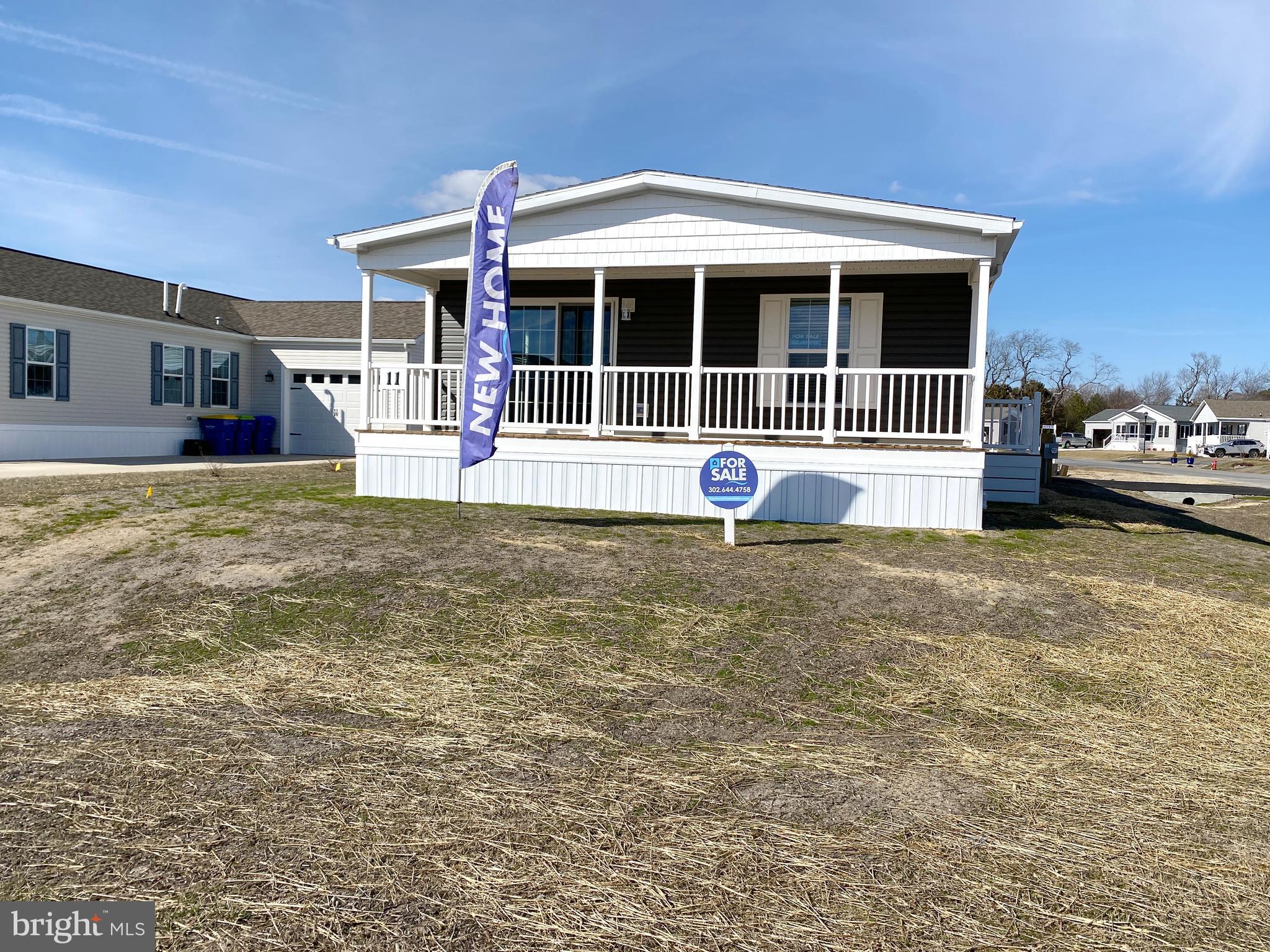 11 Folkstone Lane Lewes, DE 19958 - Photo 4 of 47 a front view of a house with a yard