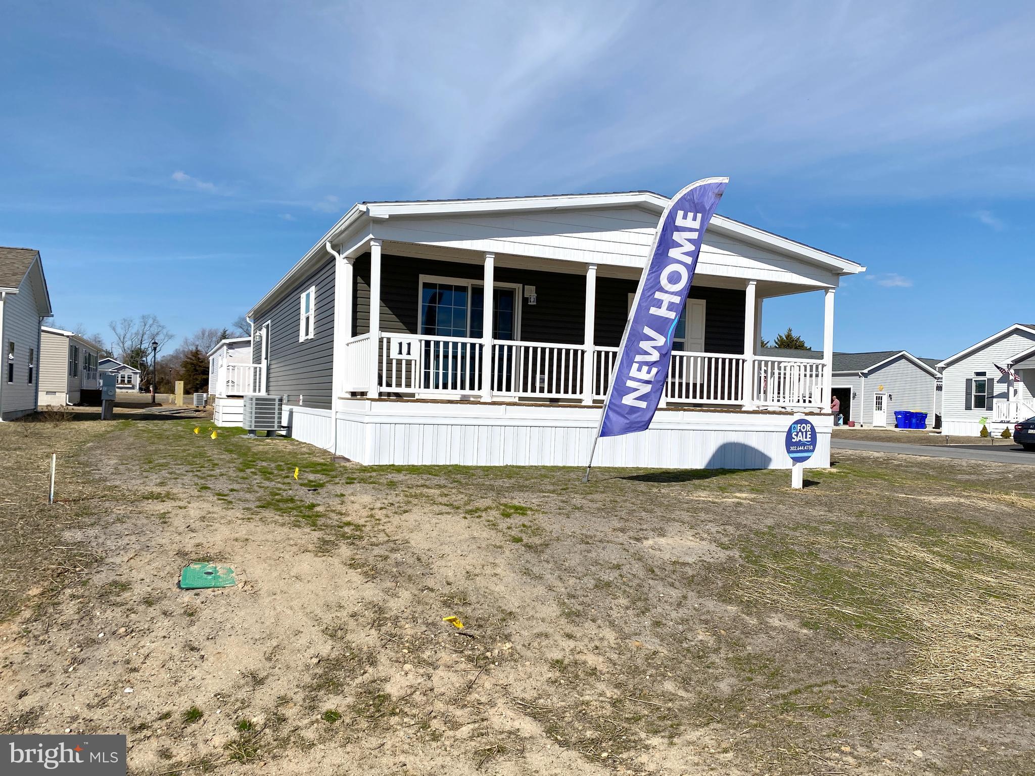 11 Folkstone Lane Lewes, DE 19958 - Photo 6 of 47 a front view of a house with garden