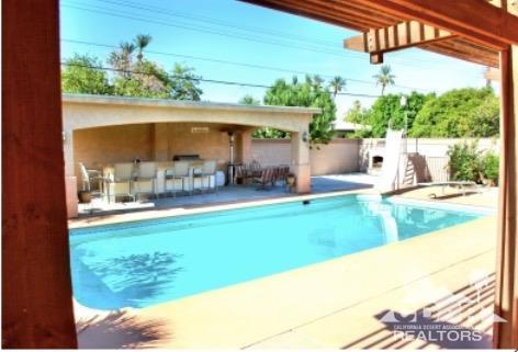 81256 Alberta Avenue Indio, CA 92201 - Photo 15 of 18 a view of a swimming pool with a patio