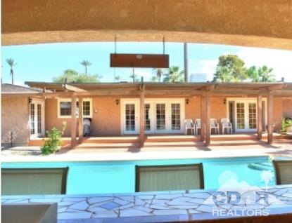 81256 Alberta Avenue Indio, CA 92201 - Photo 17 of 18 a front view of a house with a yard