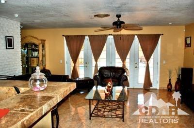 81256 Alberta Avenue Indio, CA 92201 - Photo 3 of 18 a living room with a couch and a table