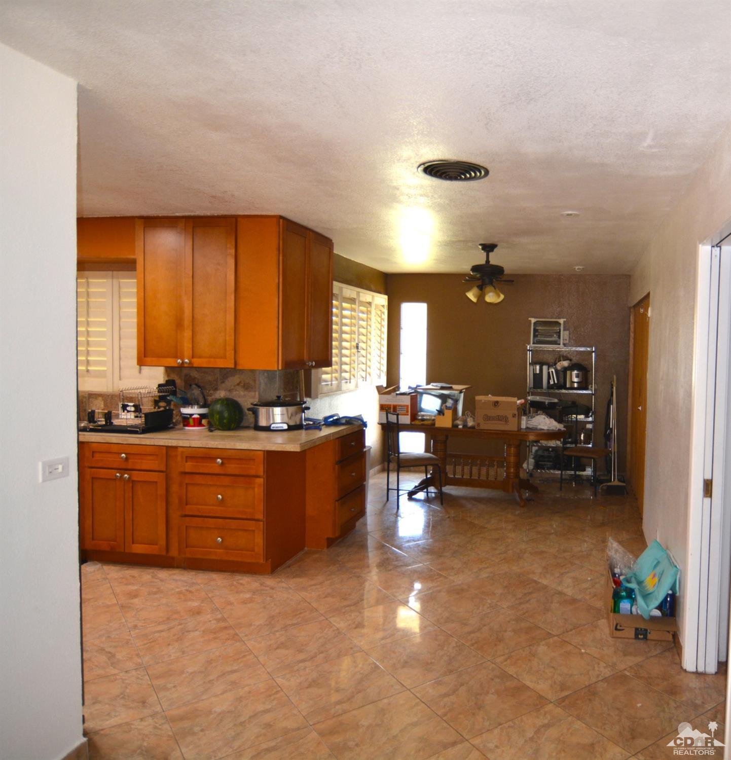 81256 Alberta Avenue Indio, CA 92201 - Photo 8 of 18 a living room with furniture and a large window