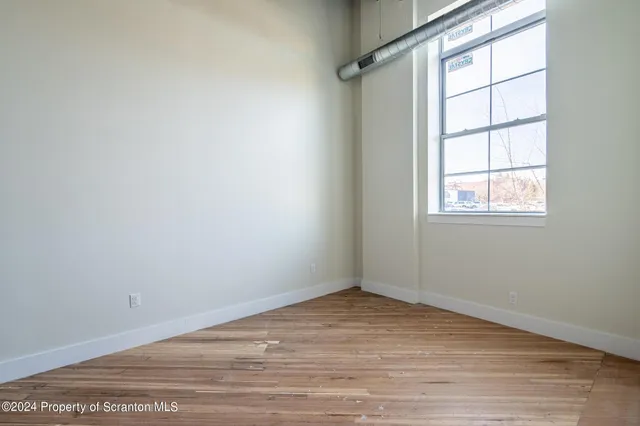a kitchen with a sink stove and microwave