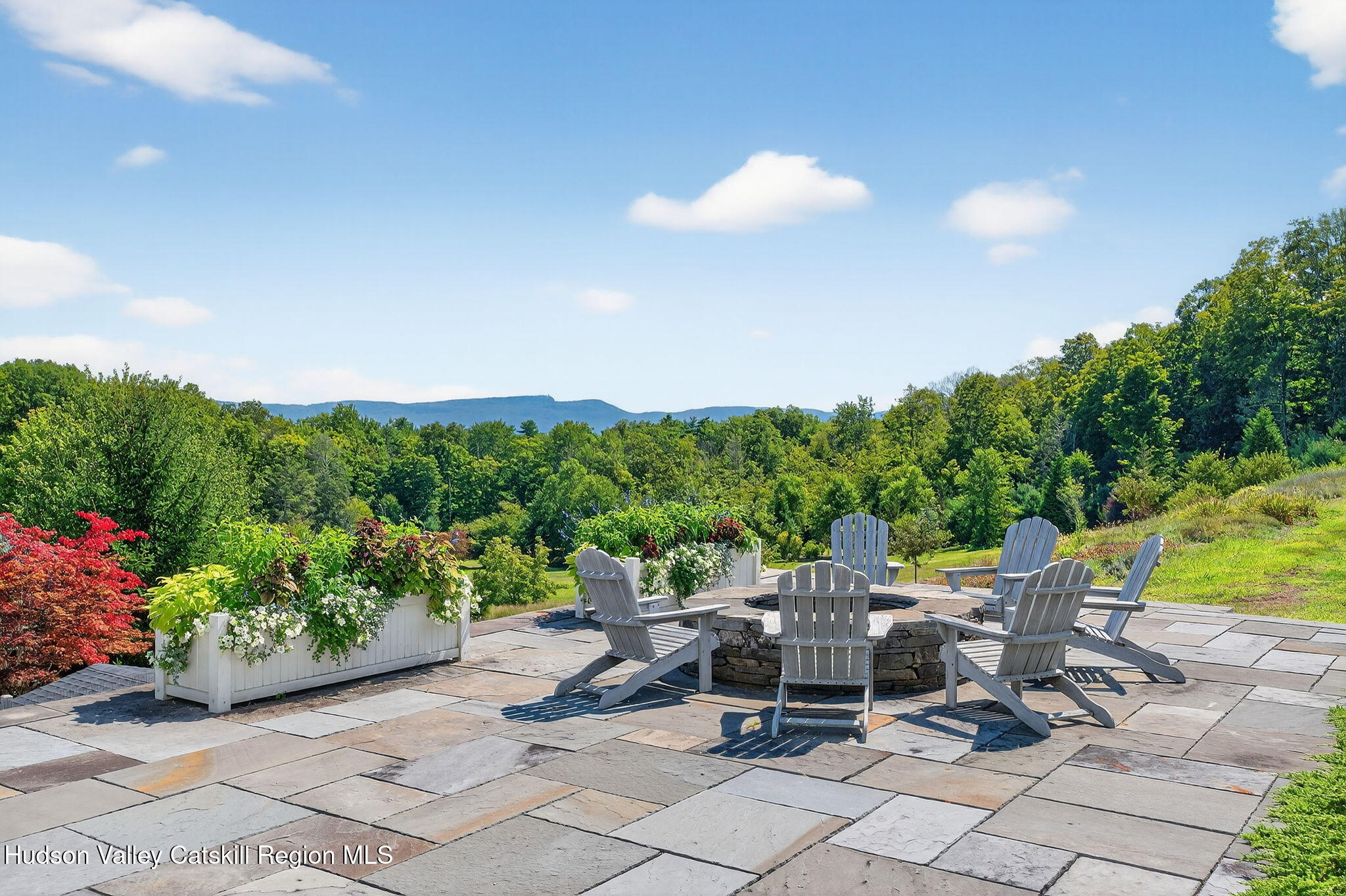 197-199 Chestnut Hill Road Stone Ridge, NY 12484 - Photo 11 of 63 a view of a patio with a table and chairs and potted plants