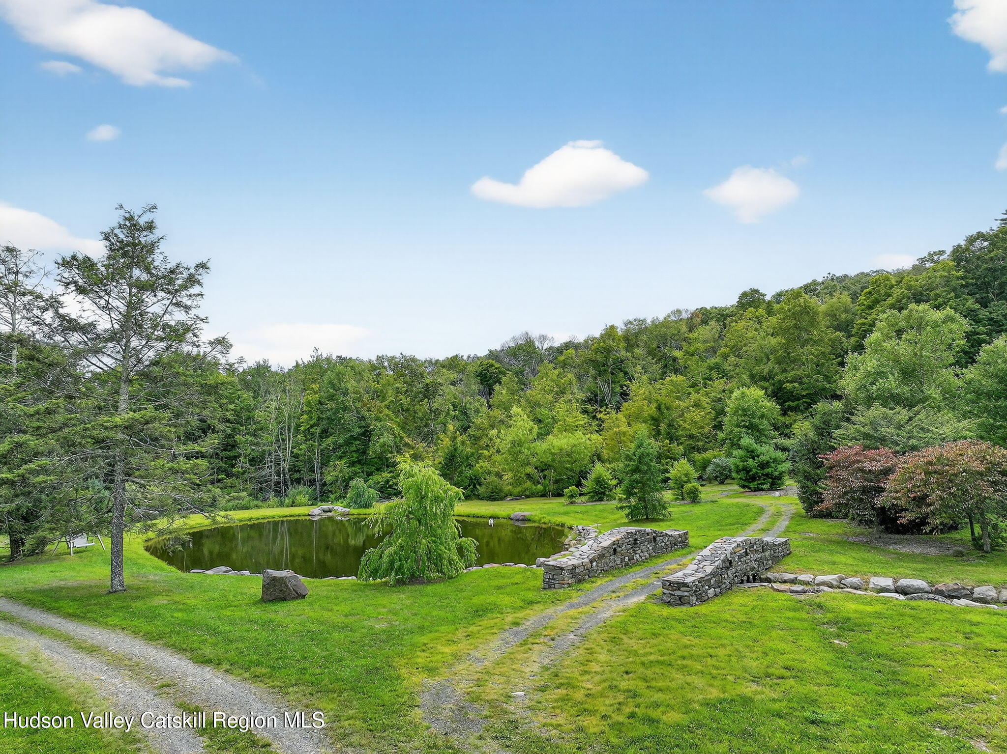 197-199 Chestnut Hill Road Stone Ridge, NY 12484 - Photo 25 of 63 a view of a golf course with a lake