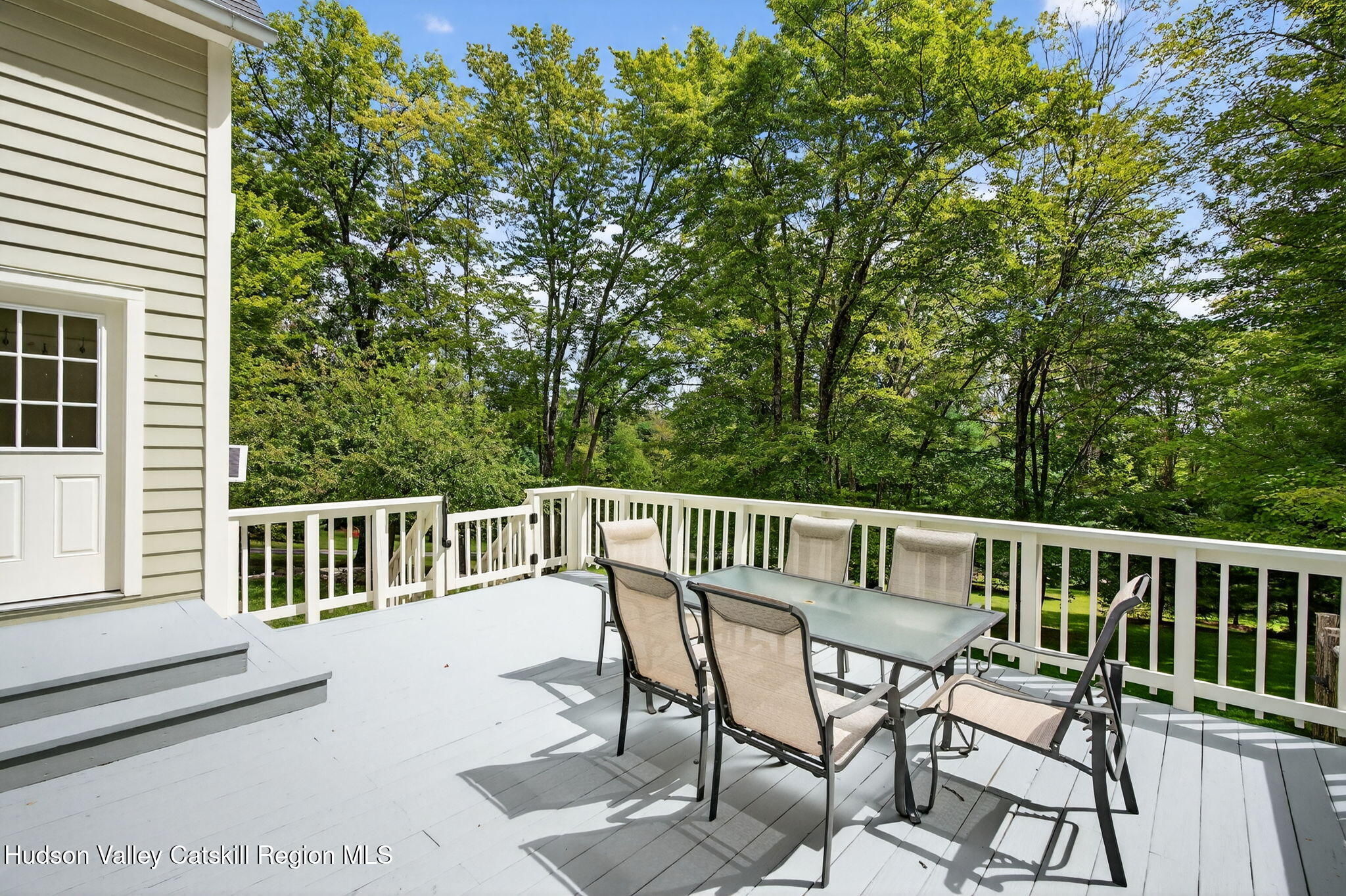 197-199 Chestnut Hill Road Stone Ridge, NY 12484 - Photo 50 of 63 a view of a chair and table on the deck