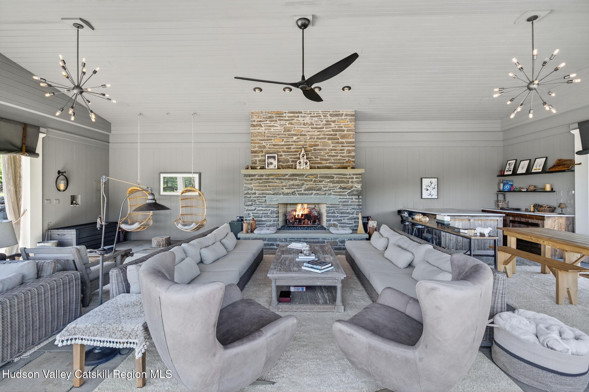 197-199 Chestnut Hill Road Stone Ridge, NY 12484 - Photo 8 of 63 a living room with furniture a chandelier and a fireplace